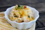 This Twice Baked Potato Casserole is like a loaded baked potato without all the work! Creamy mashed potatoes, bacon, cheese, green onions...you've got to try this!